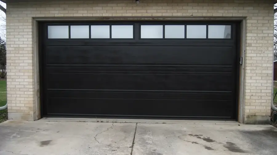 New black garage door after replacement by Local Garage Doors