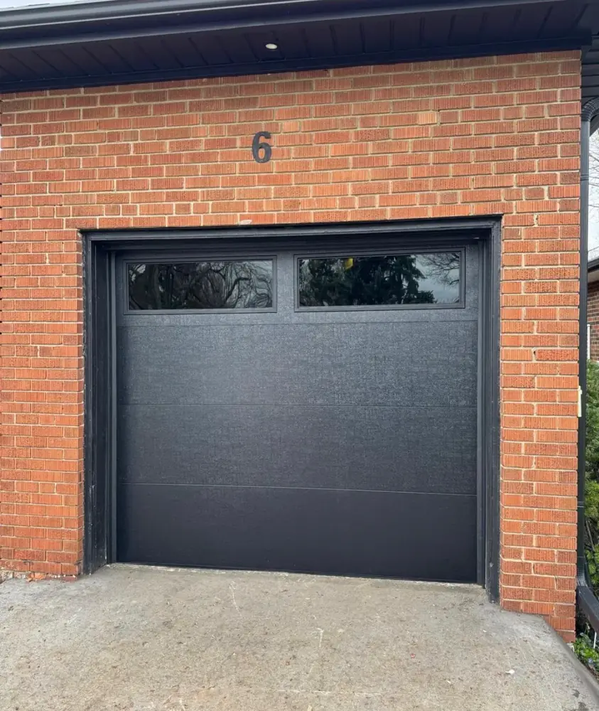 New black garage door installed in Ottawa